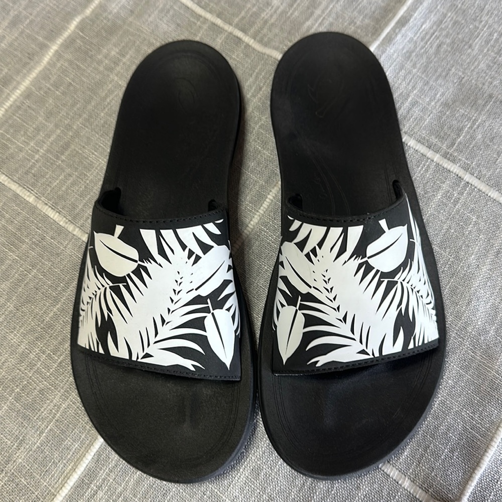 Olukai black and white slip on sandal.  - size 8
